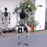 Light powered robot climbs tracks like tiny cable car